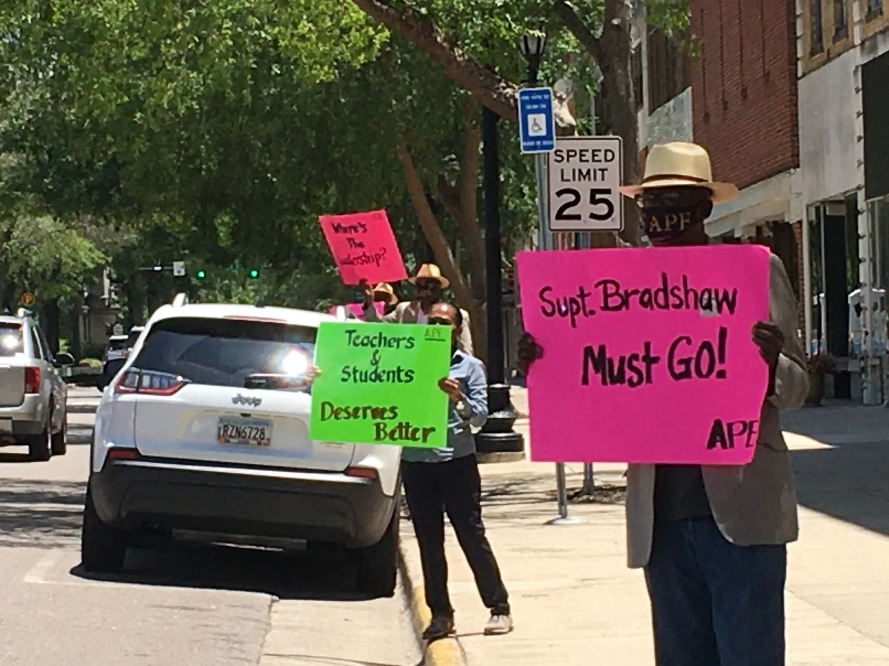 A.P.E. advocates making a public stand outside a school district office
